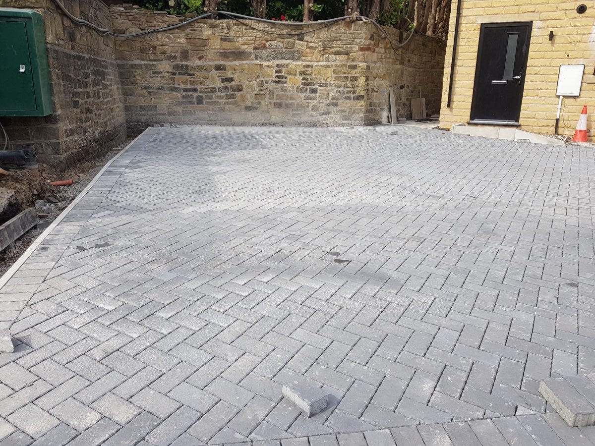 Grey herringbone block paving driveway