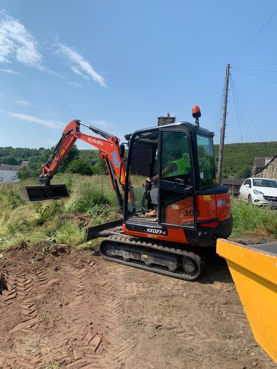 Mini excavator and dumper on site — photo 1