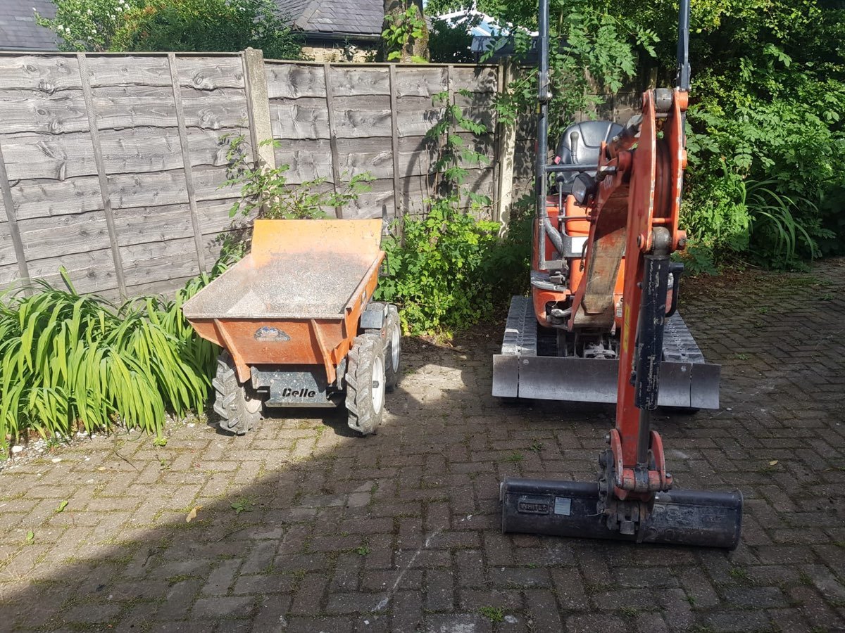 Mini excavator and dumper on site