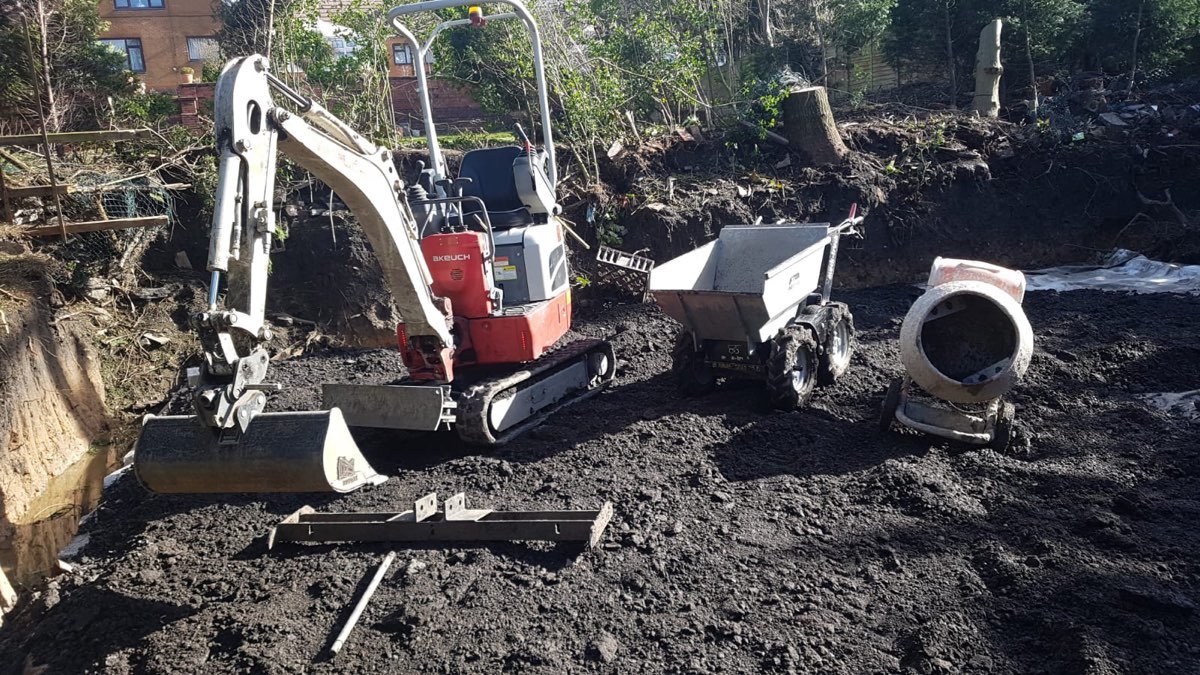 Mini excavator and dumper on site — photo 5